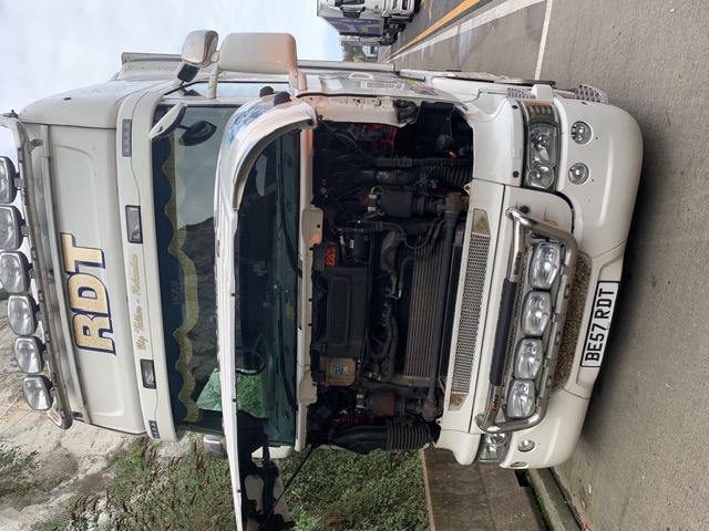 Scania truck with the cab tilted for engine access